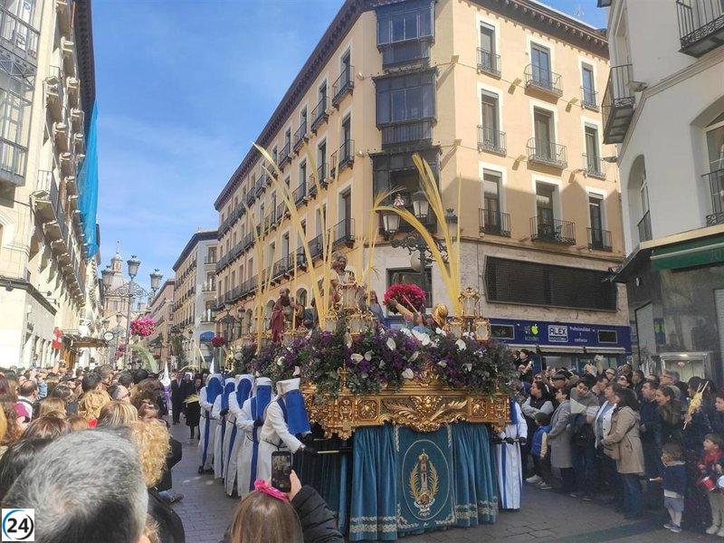 Nueve cofradías de Zaragoza conmemoran el Domingo de Ramos con la entrada de Jesús en Jerusalén.